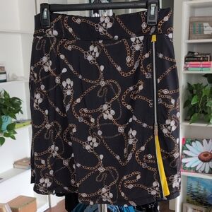 Chic Black Chain Print Skort with Yellow Accent
